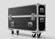 The 42" Double Screen Case, featuring a large black and silver design with metal edges, reinforced corners, and four caster wheels, is shown standing on a plain white background.