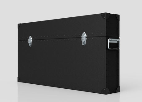 The 65" Single Screen Lite Guard™ Case is a large, black HDPE transport case with metal corner protectors, two silver latches, and a side handle, designed for secure display transport. Shown against a plain light background.