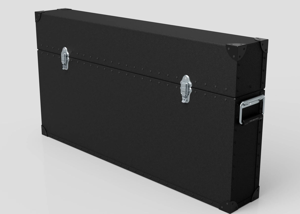 The 65" Single Screen Lite Guard™ Case, a black lightweight HDPE display transport case with metal corner reinforcements, two silver latches, and a side handle, is shown against a plain background.