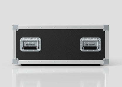 A rectangular black 6U Shock Mount Slam Rack Case with silver metal edges and two metal handles labeled “Nomad,” stands upright on a white surface against a plain background.