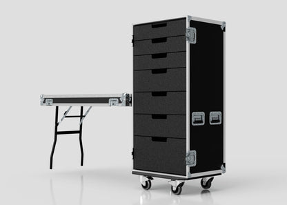 A black 7 Drawer Production Case with metal handles, a rolling design, and a side-attaching trestle table with sturdy metal legs, shown against a plain light background.