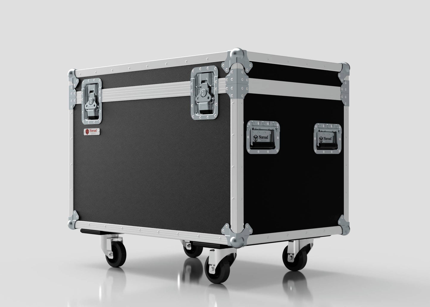 The 900mm Trunk Case is a large black and silver equipment case with metal reinforcements, handles, and four caster wheels. It stands against a plain light background and has external dimensions of 925 x 607 x 765 mm.