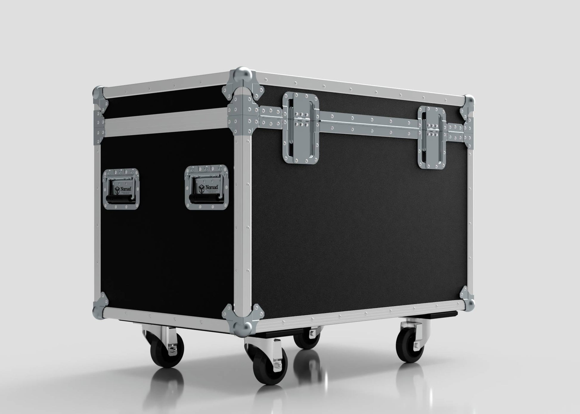 The 900mm Trunk Case is a large black road case with metal reinforcements, handles, and latches, standing on four caster wheels. It features external dimensions of 925 x 607 x 765 mm.