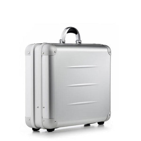 The ALUpur 98300, a silver anodised aluminium case with rounded edges, metal hinges, and a metallic handle, stands upright against a plain white background.