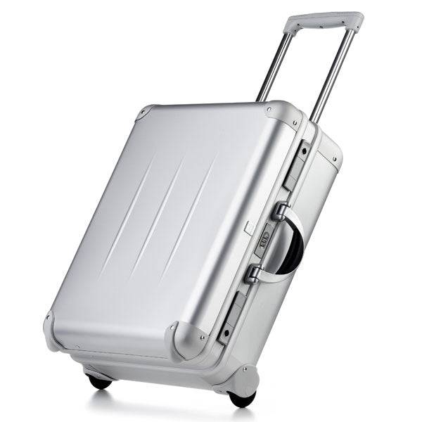 The ALUpur 98700N is a silver aluminium case with two wheels, a telescopic handle, and CNC foam fittings, shown upright on a white background.