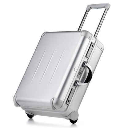The ALUpur 98700N is a silver aluminium case with two wheels, a telescopic handle, and CNC foam fittings, shown upright on a white background.