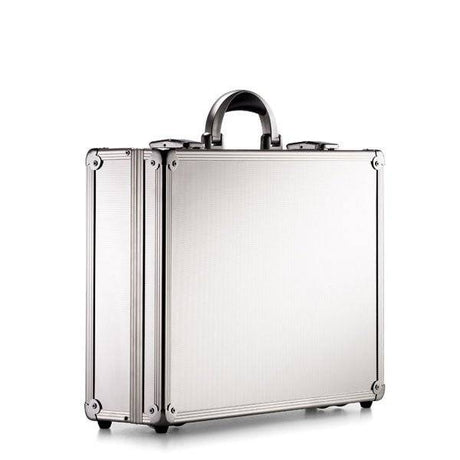 The ARK 90100 is a sturdy silver metal briefcase with reinforced corners, a black handle, and an aluminium frame, shown standing upright against a plain white background.