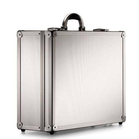 The ARK 90700 is a silver, robust aluminium frame case with reinforced metal corners, a rounded handle, and custom CNC foam fittings, seen standing upright on a white background.