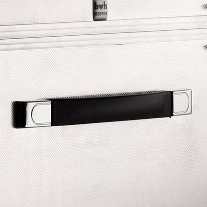 A close-up of a black and silver handle mounted on a textured, light surface, likely the ARK 90900 aluminium frame case with custom CNC foam fittings for added protection.