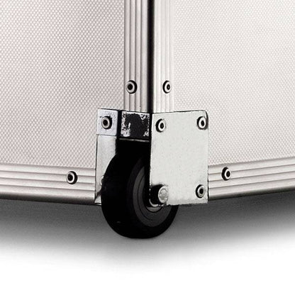 Close-up of the ARK 90900 case corner shows a black caster wheel, silver hardware, and textured white paneling—built with a durable aluminum frame and custom CNC foam for superior protection.