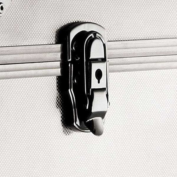 Close-up of a metal latch lock with a keyhole on the textured silver surface of the ARK 90900 aluminium frame case, which may include custom CNC foam fittings for enhanced protection.