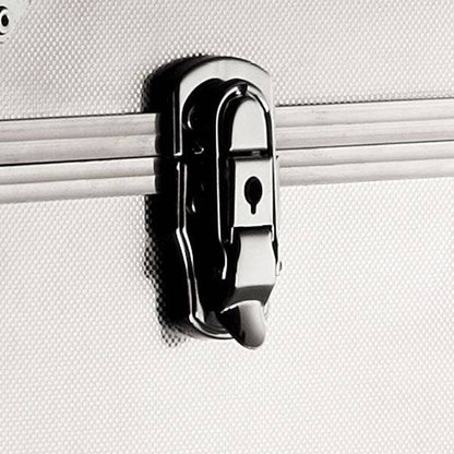 Close-up of a metal latch lock with a keyhole on the textured silver surface of the ARK 90900 aluminium frame case, which may include custom CNC foam fittings for enhanced protection.