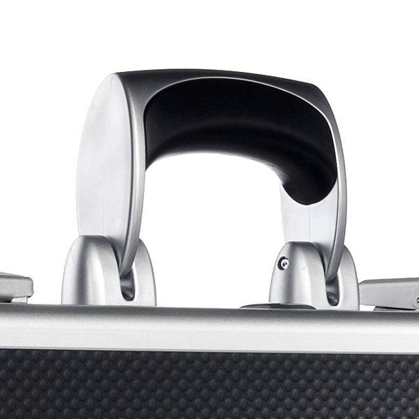 Close-up of the AZKE 95300 suitcase handle in silver and black, attached to a textured aluminum frame case featuring a scratch-resistant surface.