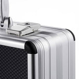 A close-up view of the AZKE 95600, featuring a silver aluminium frame, textured black panel, metal clasp lock, and scratch-resistant finish.