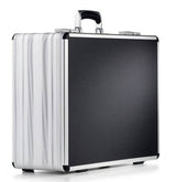 The AZKE 95700, a silver and black aluminium frame case with a textured front, sturdy handle, custom CNC foam fittings, and reinforced corners, is shown against a white background.
