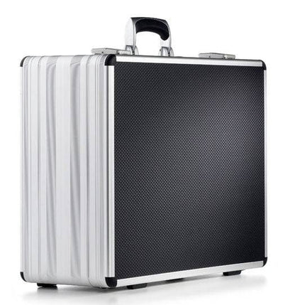 The AZKE 95700, a silver and black aluminium frame case with a textured front, sturdy handle, custom CNC foam fittings, and reinforced corners, is shown against a white background.