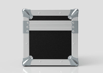 A Camera Lens Case in square black and silver metal with reinforced corners, shown closed and upright against a plain light background.