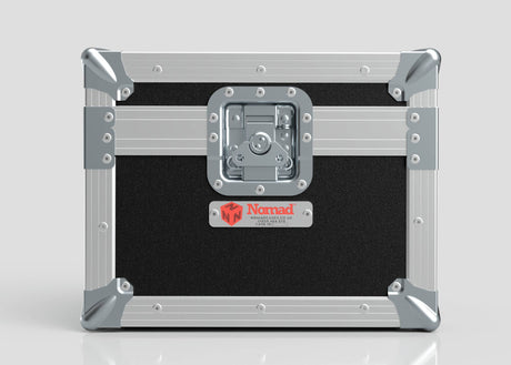Black and silver Camera Lens Case with reinforced metal corners, a central latch, and a red Nomad label on the front.