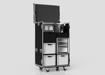 The Catering Case, shown open against a plain background, features compartments for a microwave, coffee maker, mini fridge, and white bins. It is black, on wheels, and measures 911 x 735 x 1567 mm externally.