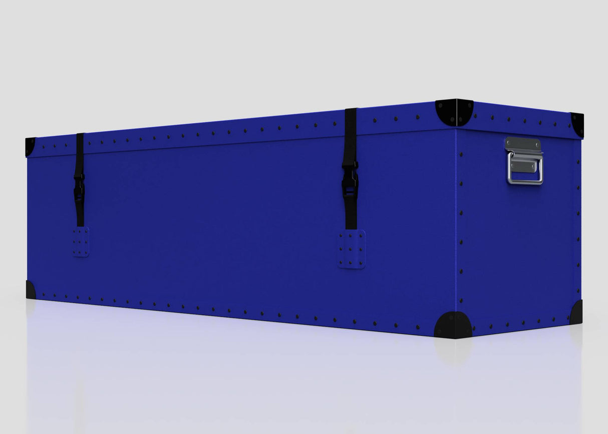 The Cricket Storage Poly Case (Large) is a rectangular blue polyethylene box with black corner protectors, metal rivets, two black straps with side-release buckle, and a metal handle at one end, shown on a plain white background.