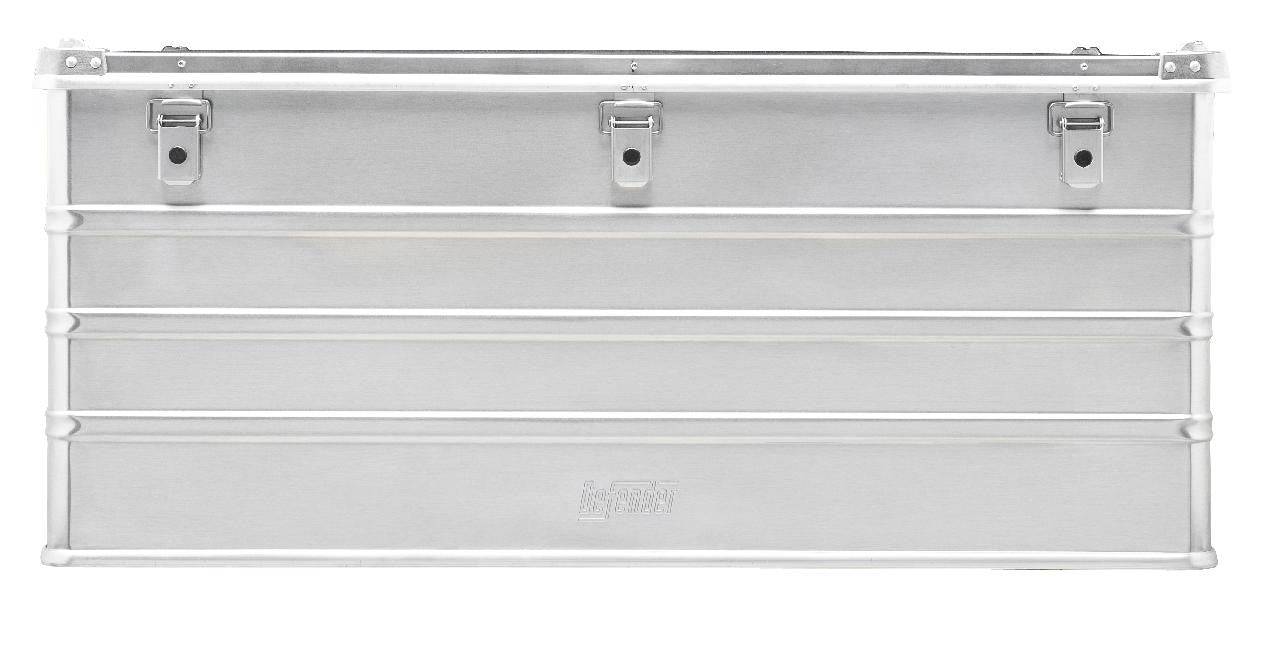 The Defender KA64-012 is a rectangular silver metal storage box with three lid latches, front horizontal ridges, and a custom routed foam interior for secure organization.