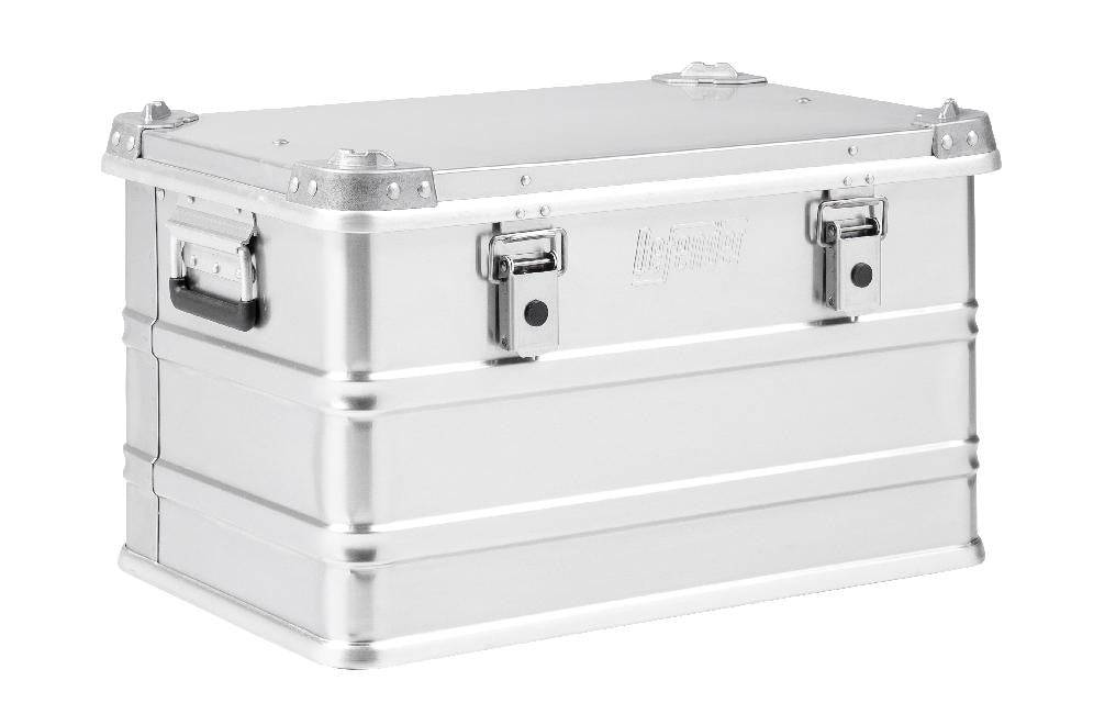 The Defender KA74-004 is a rectangular silver metal storage box with side handles, two front latches, and a 60-litre capacity, shown against a white background.