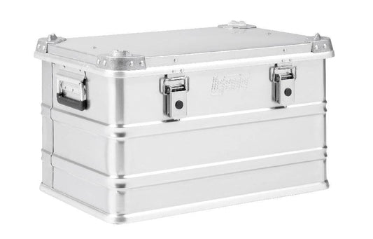 The Defender KA74-004 is a rectangular silver metal storage box with side handles, two front latches, and a 60-litre capacity, shown against a white background.
