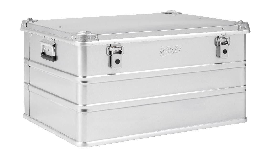 The Defender KA74-010 is a rectangular silver metal storage box with latches and side handles, displayed on a white background. It features a custom routed foam interior and a 155L capacity for secure transport.