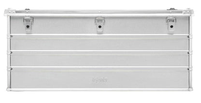 The Defender KA74-012 is a rectangular silver metal storage box with three top-edge latches, horizontal ridges, a plain front, and custom routed foam inside to securely protect your items.