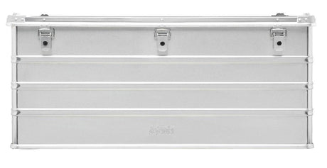 The Defender KA74-012 is a rectangular silver metal storage box with three top-edge latches, horizontal ridges, a plain front, and custom routed foam inside to securely protect your items.