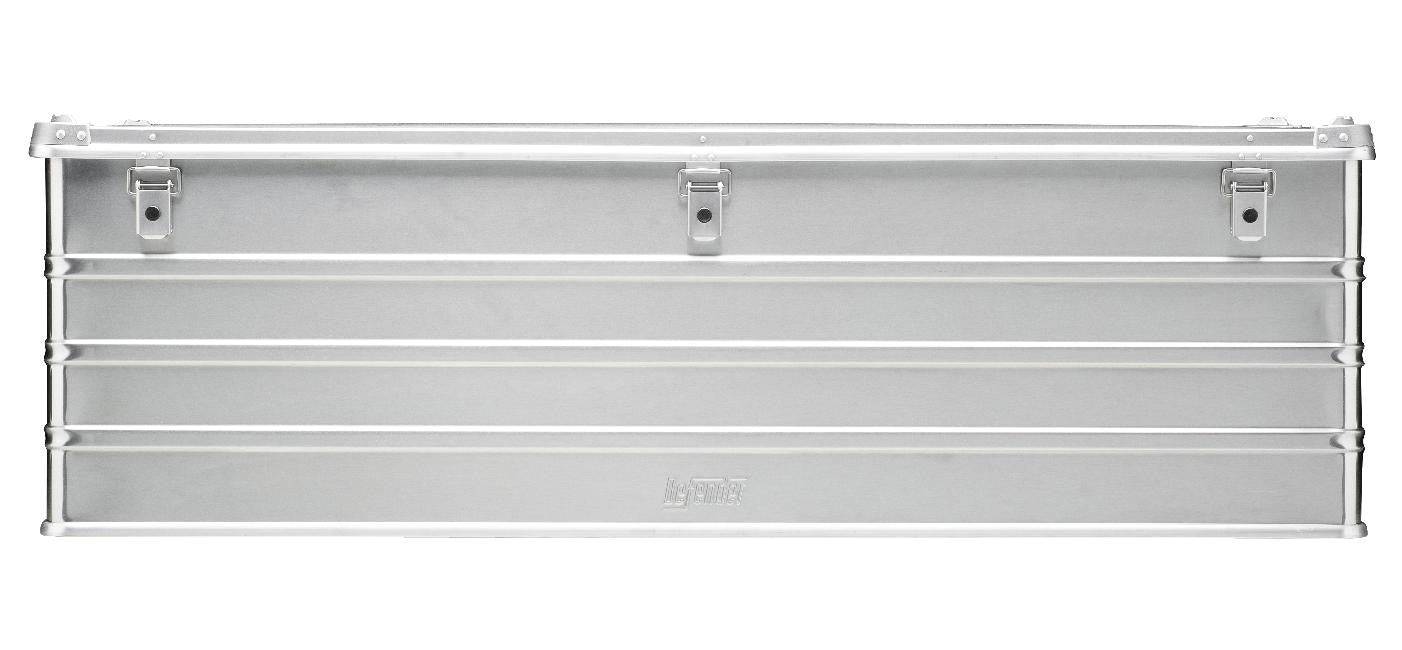 The Defender KA74-013 is a rectangular silver metal toolbox with horizontal ridges, three front latches, a flat hinged top, and a custom routed foam interior for secure tool storage.