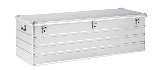 The Defender KA74-013 is a rectangular silver metal case with screen print, three front latches, side handles, and a custom routed foam interior, shown on a white background.