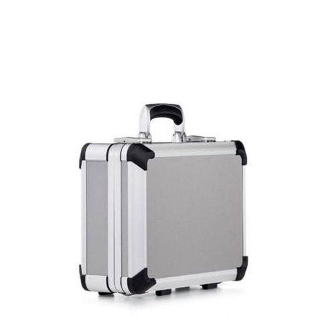 The Exclusive 93400 is a compact aluminium frame case with black corner protectors, custom CNC foam interior, and ergonomic handle, shown against a plain white background.