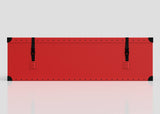 The Football Storage Poly Case (Large) is a long, flat red rectangular polyethylene box with black corner protectors and two black straps with webbing buckle fastenings, shown on a plain light background.