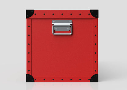 The Football Storage Poly Case (Large) is a red polyethylene box with black corner protectors, a zinc drop handle, and a webbing buckle, shown against a plain light background.