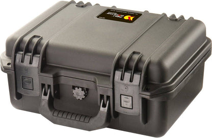 The iM2100 Storm Case is a closed, hard-shell black case with a handle and dual latches, plus a small label on top. This crushproof PELI case ensures reliable protection for your gear.