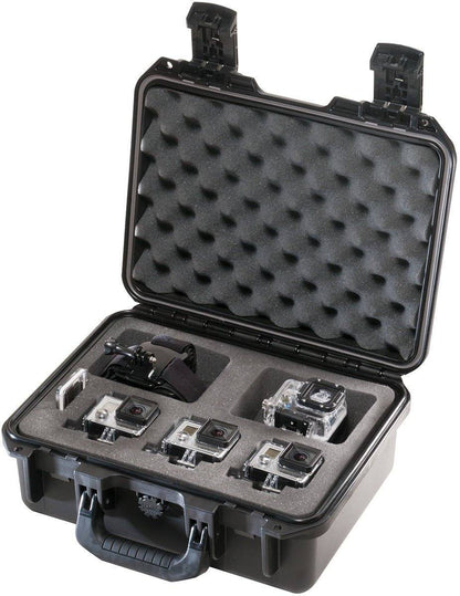 An iM2100 Storm Case with custom foam compartments securely holds four action cameras and a mounting accessory. The watertight case is open, displaying the neatly organized equipment inside.