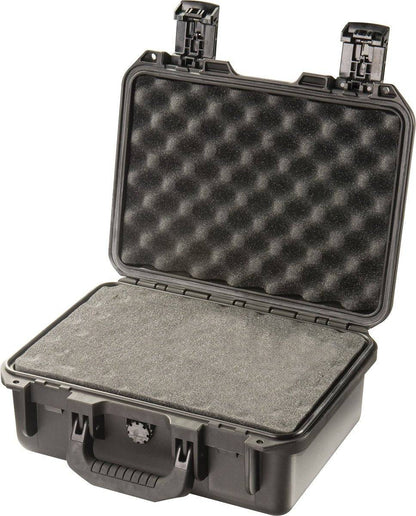 An open black iM2100 Storm Case with egg-crate foam inside, lid up and latches open; this watertight, crushproof case offers ultimate protection.