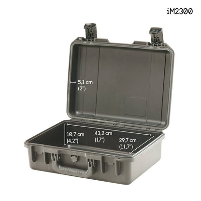 The iM2300 Storm Case is shown open, made of grey hard plastic, with interior dimensions labeled: 5.1 cm deep, 43.2 cm wide, and 29.7 cm long. The model name highlights its protective case design in the top right corner.