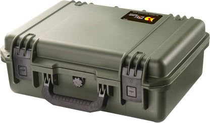 The iM2300 Storm Case is a sturdy, olive green hard plastic case with a black handle, secure latches, watertight design, and a rectangular label on the top corner.
