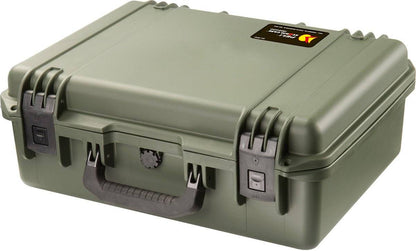 A closed, hard-shell olive green iM2400 Storm Laptop Case with black latches, a handle, and a small rectangular label on the lid—a crushproof case designed for maximum protection.