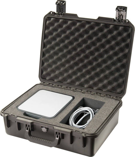 The iM2400 Storm Laptop Case features foam inserts to securely hold a flat electronic device and coiled cable. This crushproof, watertight case reveals well-designed interior compartments for optimal protection when open.