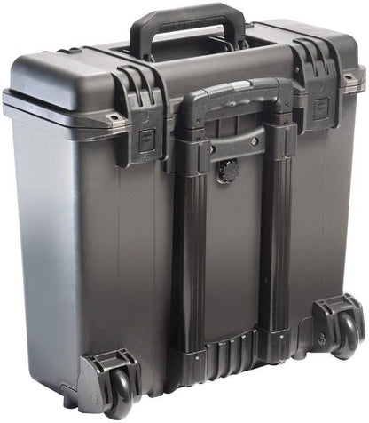 The iM2435 Storm Top Loader Case is a black hard-shell rolling case with handle and latches, designed to be crushproof and watertight for protective transport of equipment.