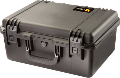 The iM2450 Storm Case is a closed, hard plastic black case with a handle, secure latches, and a small top-corner label. This crushproof PELI case provides durable protection for your valuables.