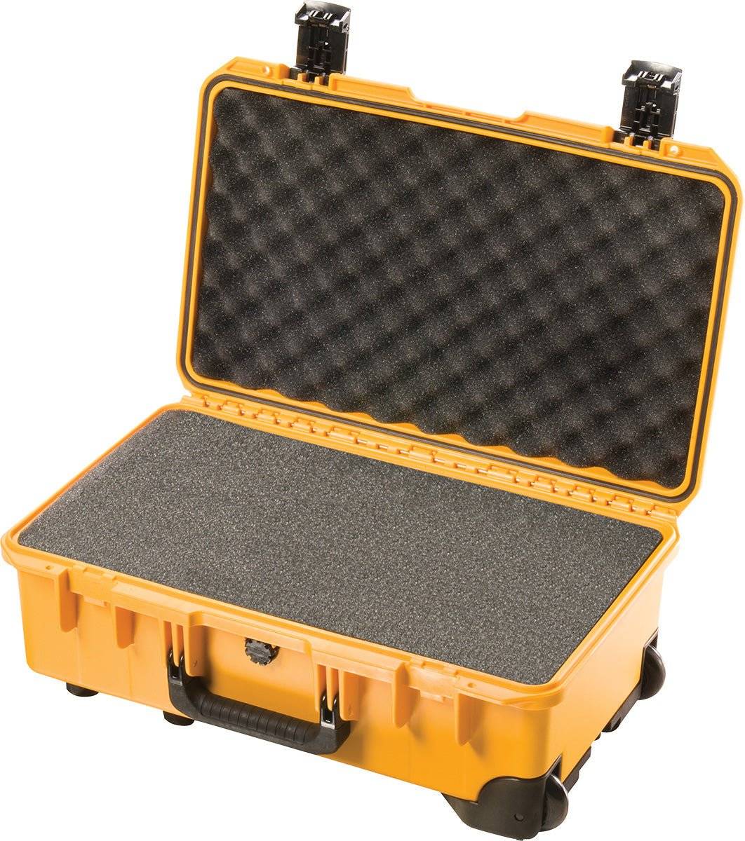 The iM2500 Storm Carry-On Case is an open yellow PELI Storm Case with foam padding inside, designed to safely store and transport equipment while being crushproof.