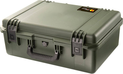 The olive green iM2600 Storm Case features black latches, a handle, and a small top right label—this crushproof PELI case is built to protect your valuables.