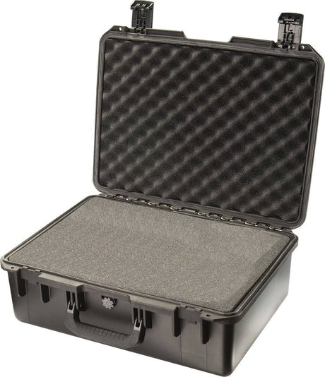 A black iM2600 Storm Case is open, showing foam padding in the lid and base. This crushproof case offers maximum security for delicate equipment.