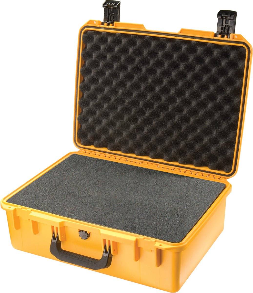 The yellow hard plastic iM2600 Storm Case has an open lid, showing black foam padding inside for protection. This crushproof case keeps your items safe and secure.