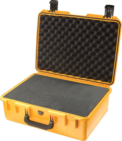 The yellow hard plastic iM2600 Storm Case has an open lid, showing black foam padding inside for protection. This crushproof case keeps your items safe and secure.