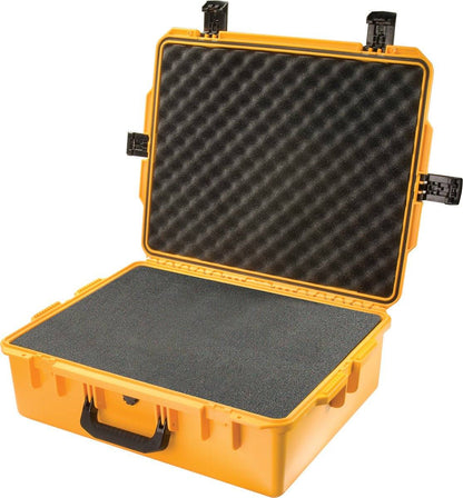 The iM2700 Storm Case is a yellow carrying case with black foam padding, shown open with unclasped latches and a front handle, offering reliable crushproof protection for your gear.